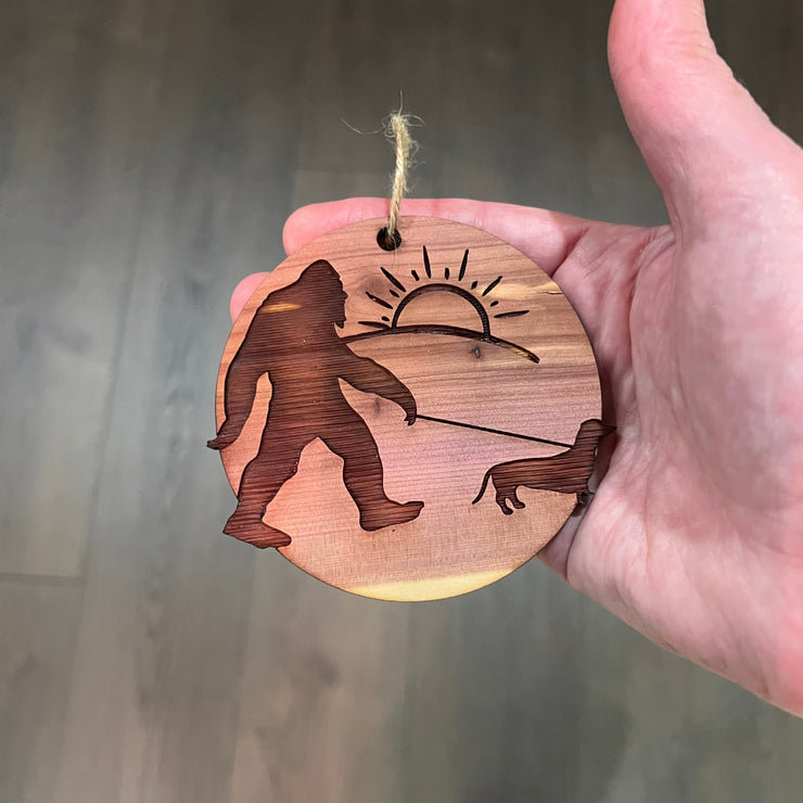 Sasquatch walking his dog - Cedar Ornament